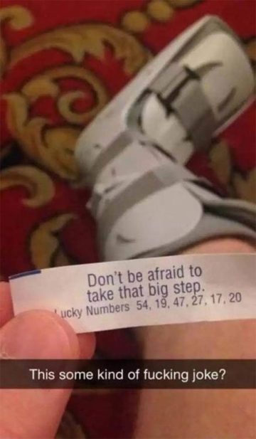 Fortune cookie message about taking a big step with a foot cast.