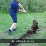 Golfer swings and lifts a giant piece of turf into the air.