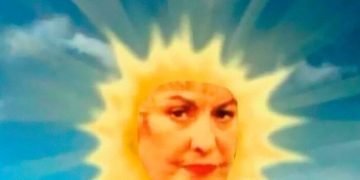 Grumpy sun face in a cheerful sky with "Me trying to be a ray of sunshine."