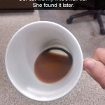Cat hides hair tie in a coffee cup, surprise revealed.