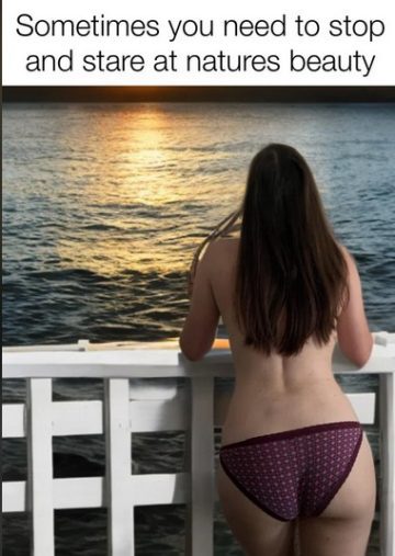 Person admiring a sunset over water from a balcony.