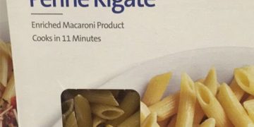 Close-up of penne pasta box showing a different pasta type inside.