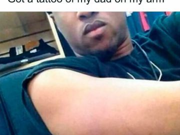 Man shows off his arm with an invisible tattoo of his dad
