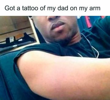 Man shows off his arm with an invisible tattoo of his dad