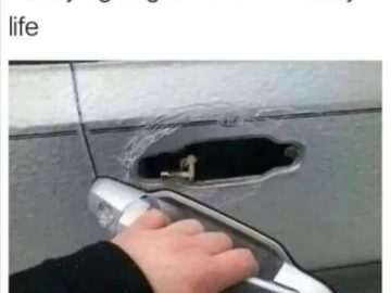 Hand holding a broken car door handle with text about life