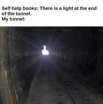 A dark tunnel with a middle finger light at the end.