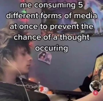 Person multitasking with various media to avoid thinking