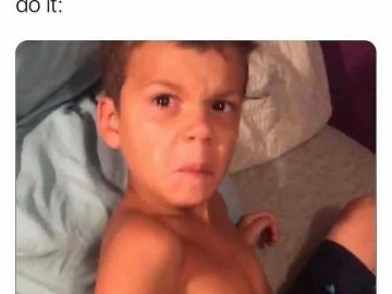 Kid making an annoyed face after being woken up early.