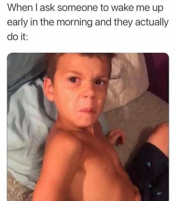 Kid making an annoyed face after being woken up early.