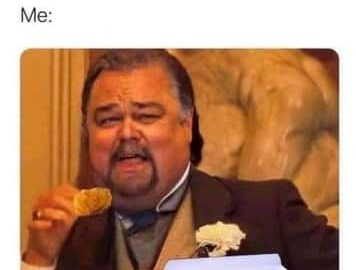 Man humorously eating a chicken nugget, ignoring shared portion size.