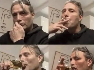 Person celebrates after completing one task from to-do list with drink