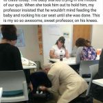 Professor kneeling to feed a baby in a classroom setting.
