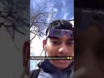 Thumbnail for a funny video showing a man wearing eclipse glasses before a sudden instant-regret fail