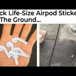AirPod sticker prank on sidewalk, people walking by confused.