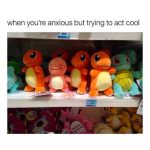 Plush Charmander looking anxious next to friends on a shelf.