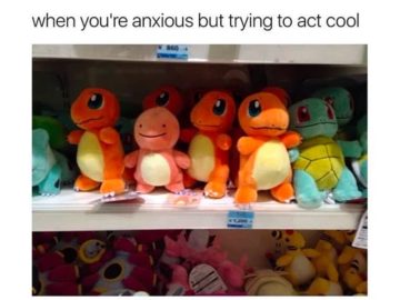Plush Charmander looking anxious next to friends on a shelf.