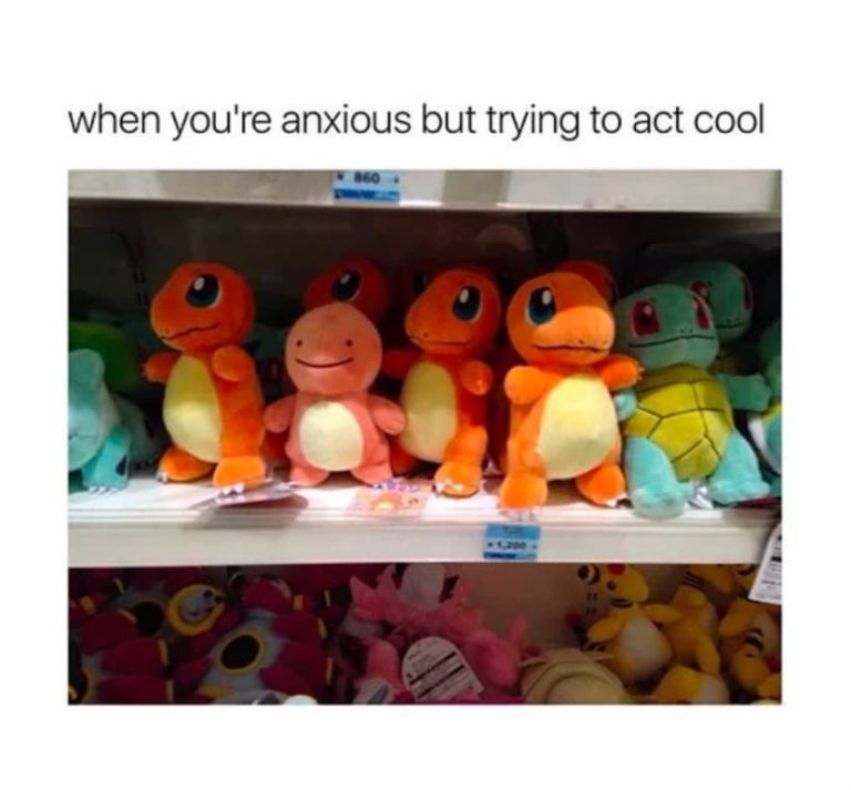 Plush Charmander looking anxious next to friends on a shelf.