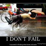 Man hilariously falling off a bike in the rain with an umbrella.