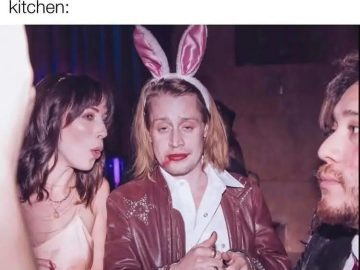 Person with bunny ears, makeup smeared, at a party looks tired.