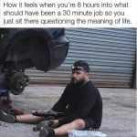 Man sitting in front of car, pondering DIY project gone long