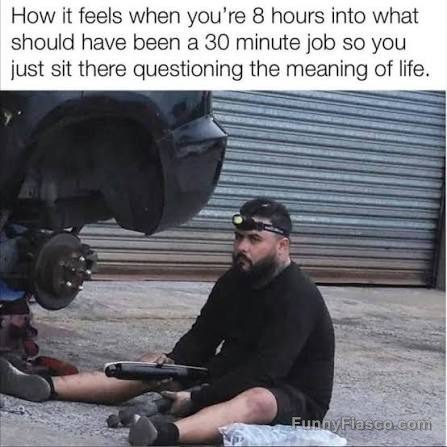 Man sitting in front of car, pondering DIY project gone long