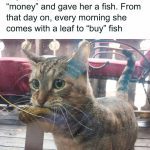 Cat holding a leaf at a fish market, ready to trade for fish.