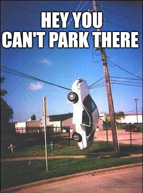 Car hanging on wires with "Hey You Can't Park There" text overlay.