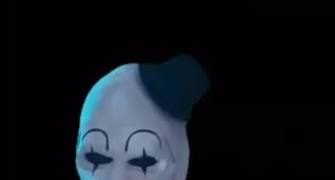 A clown reacts to an even darker humor joke punchline.