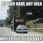 Police car behind Dunkin Donuts truck with a traffic stop joke.