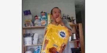 Person eating pet food after underestimating edibles' effect.