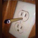 Cigarette in an outlet with the caption "No wonder my electricity bill is so high."
