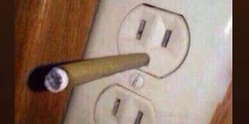 Cigarette in an outlet with the caption "No wonder my electricity bill is so high."