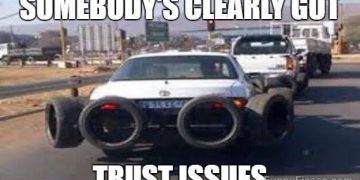 Car with tires chained to it for extra security, funny meme