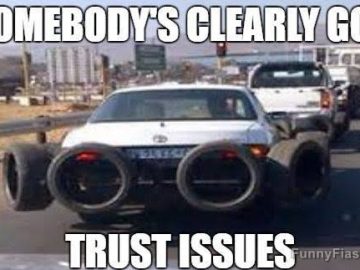Car with tires chained to it for extra security, funny meme