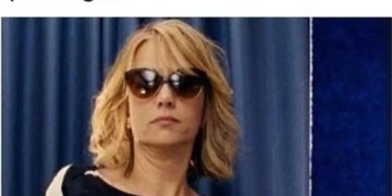 Woman in sunglasses at family event looking unimpressed.