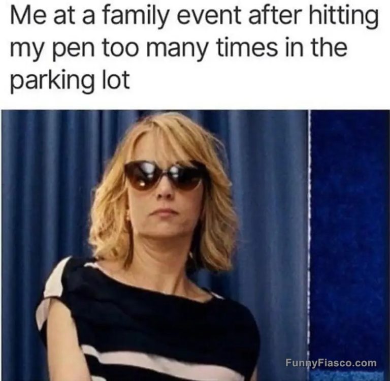 Woman in sunglasses at family event looking unimpressed.