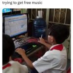 Child using an old computer, humorously risking a virus.