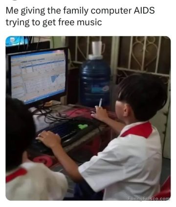 Child using an old computer, humorously risking a virus.