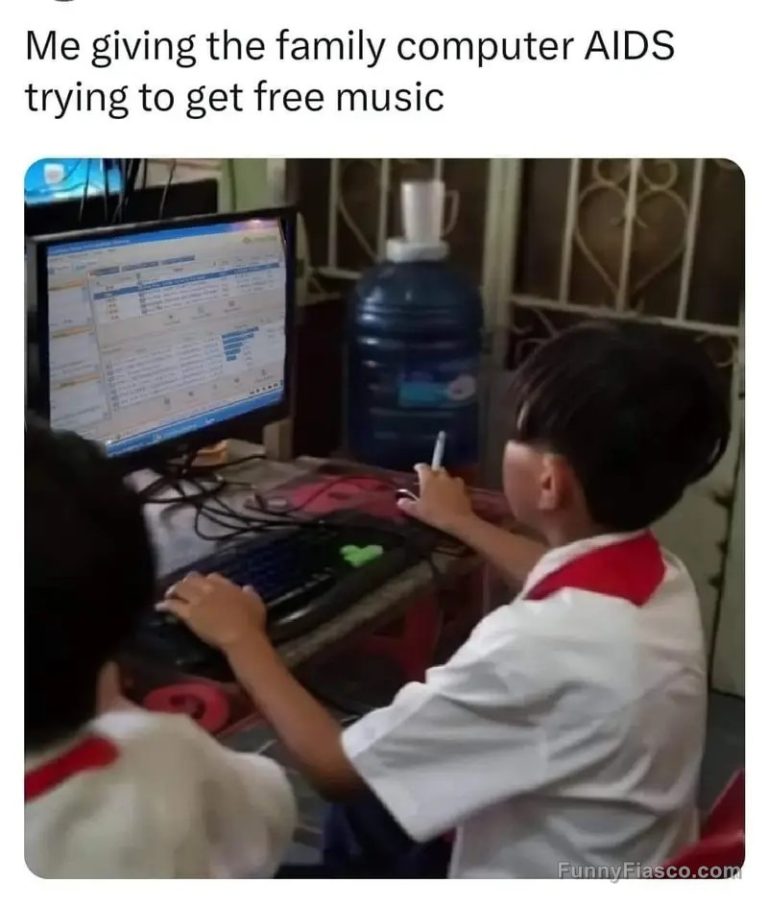 Child using an old computer, humorously risking a virus.