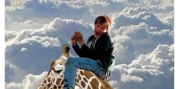 Person humorously riding a giraffe in the clouds.