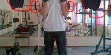 Man lifting weights poorly edited in Photoshop, gym prank style.