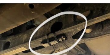 Prank with harmonica zip-tied under truck causing whistling noise.