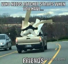Guy holding lumber in a truck with no straps, showing an epic fail.