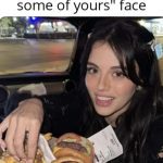 Woman reaching for food with a cheeky expression in car