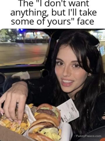Woman reaching for food with a cheeky expression in car