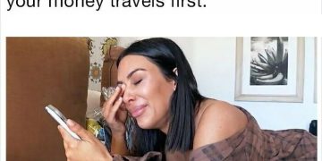 Woman crying over phone as money travels instead of her.