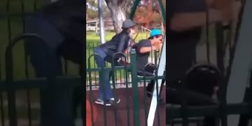 A funny fails compilation showing a person tripping with metal bowls, a patio umbrella breaking a glass table, a playground fall, and a bike crash.