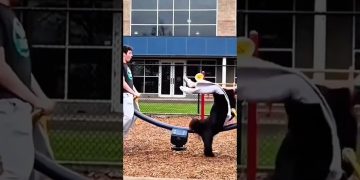 Scooter rider flipping through the air during a skatepark trick fail