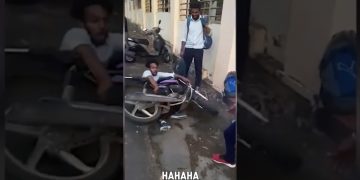 A man slips on an icy driveway while carrying an American flag during a funny fails compilation.