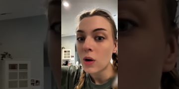 A child and adult react as colorful confetti bursts across a room during a family surprise.